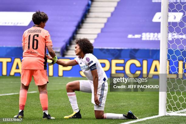 Lyons French defender Wendie Renard reacts after scoring an own goal during the UEFA Womens Champions League quarter final football match between...