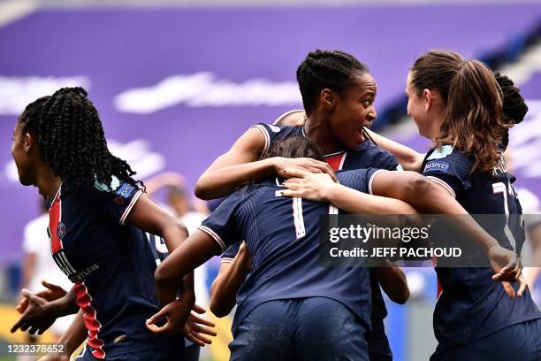 Paris' players celebrate after Lyons French defender Wendie Renard scored an own goal during the UEFA Womens Champions League quarter final football...