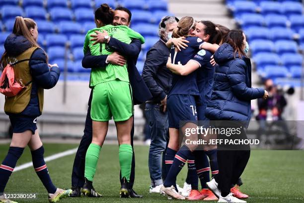 Paris Saint-Germains French coach Olivier Echouafni celebrates with his players as they win the quarter final UEFA Womens Champions League football...