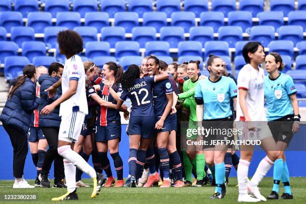 Paris Saint-Germain's players celebrate after winning the UEFA Womens Champions League quarter final football match between Olympique Lyonnais and...