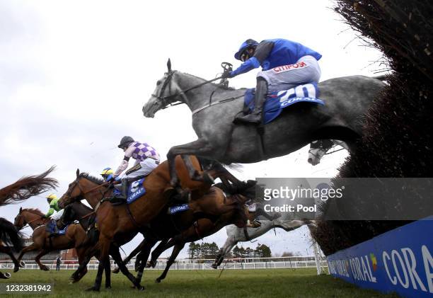General view of the runners and riders in action as they compete in the Coral Scottish Grand National Handicap Chase during the Coral Scottish Grand...