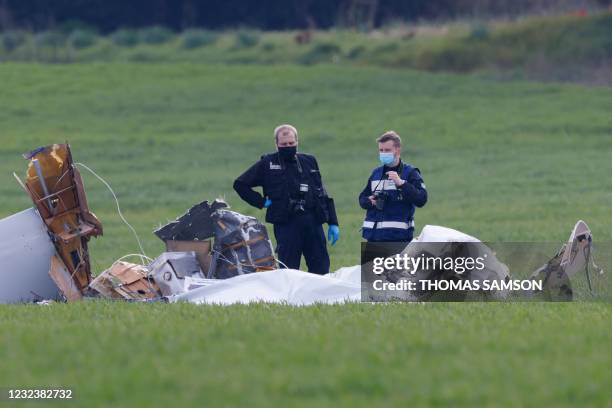 Investigators of the gendarmerie collect evidences on April 18, 2021 at the site where a Robin DR400 aircraft crashed in a field near Saint-Pathus,...