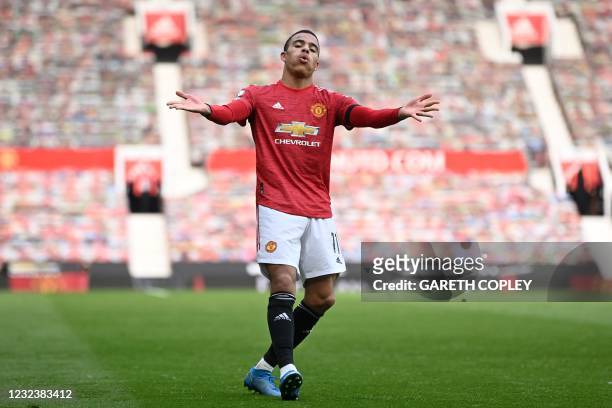 Manchester United's English striker Mason Greenwood celebrates after scoring their second goal during the English Premier League football match...