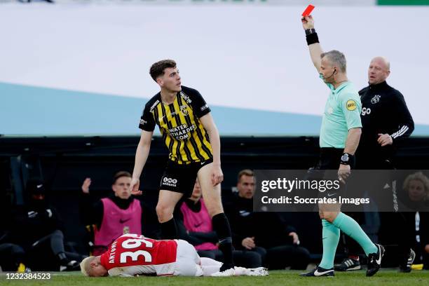 Jacob Rasmussen of Vitesse receives a red card from referee Bjorn Kuipers for a tackle on Antony of Ajax during the Dutch KNVB Beker match between...