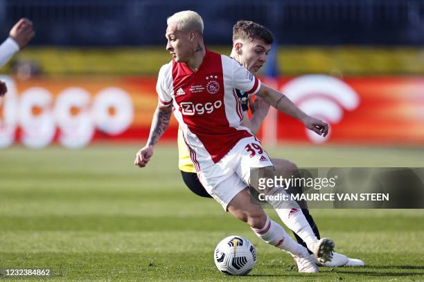 Ajax's Bra zilian forward Antony Matheus Dos Santos fights for the ball against Vitesse's Danish defender Jacob Rasmussen during the Toto KNVB cup...