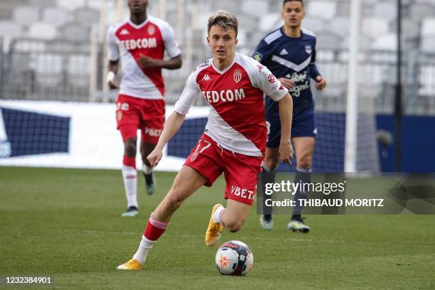 Monaco's Russian midfielder Aleksandr Golovin runs with the ball during the French L1 football match between Girondins de Bordeaux and AS Monaco at...