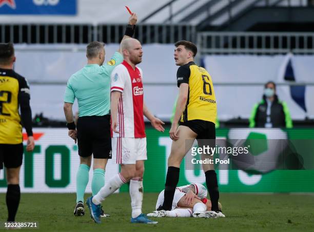 Referee Bjorn Kuipers shows a red card to Jacob Rasmussen of Vitesse after a foul on Antony of Ajax, lying on the pitch, during the TOTO KNVB Cup...