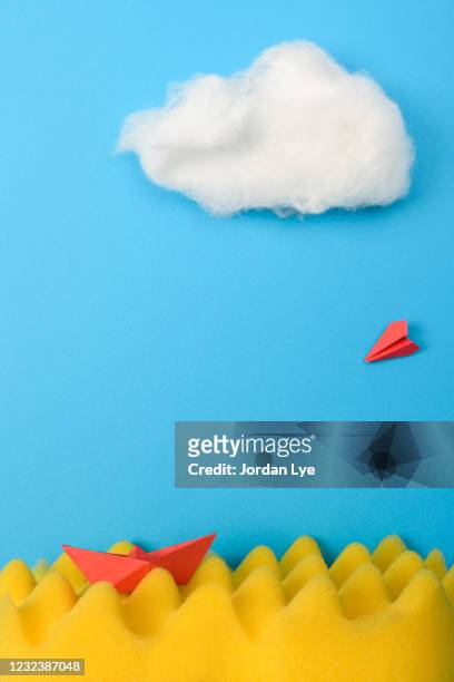 paper boat sailing and paper plane flying - cotton cloud stock pictures, royalty-free photos & images