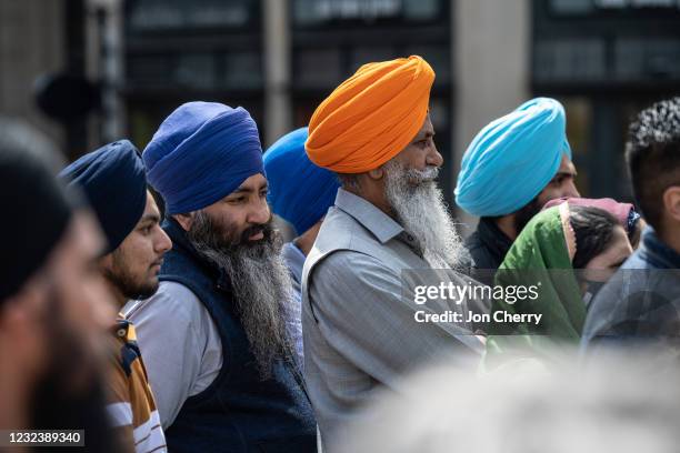 Members of the Sikh community gather and listen during a vigil at Monument Circle on April 18, 2021 in Indianapolis, Indiana. The vigil is held for...