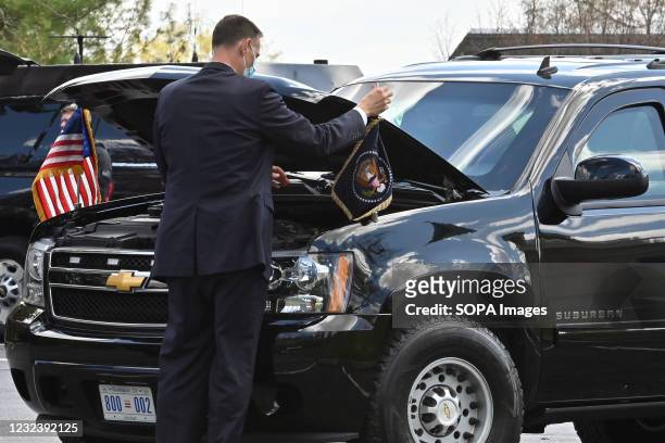 Secret service agent removes the Presidential flag from the Beast after leaving President Joe Biden at the Church during Hunter's confirmation,...