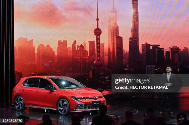 Guo Yongfeng, President of Faw-Volkswagen Sales, presents the new Volkswagen Golf GTI car during the 19th Shanghai International Automobile Industry...