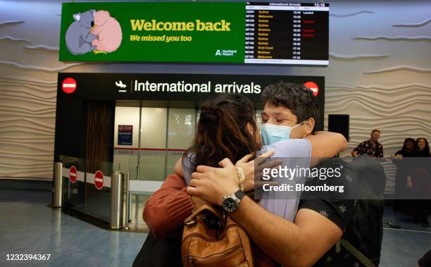 People embrace as they are reunited at Auckland International Airport in Auckland, New Zealand, on Monday, April 19, 2021. Australia and New Zealand...