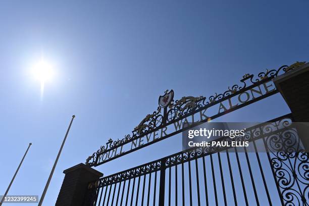 "You'll Never Walk Alone", lyrics from a song by Gerry and the Pacemakers, is pictured on the Shankly Gates at Anfield stadium, home of English...