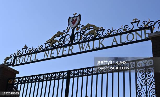 "You'll Never Walk Alone", lyrics from a song by Gerry and the Pacemakers, is pictured on the Shankly Gates at Anfield stadium, home of English...
