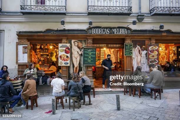 Customers tables outside a tapas bar in Madrid, Spain, on Saturday, April 10, 2021. European travel and leisure stocks have gained 20% this year on...