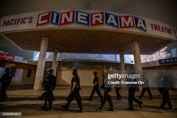 Walk past the now closed iconic Cinerama Dome as they follow a group through the streets of Hollywood. An anti-police brutality vigil took place near...