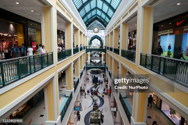 People go shopping at the reopened Colombo shopping center in Lisbon, Portugal on April 19, 2021. Portugal begins third phase of COVID-19 unlocking...
