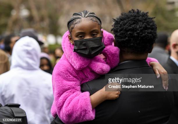 Gianna Floyd, daughter of George Floyd , is held during a press conference outside the Hennepin County Government Center on April 19, 2021 in...