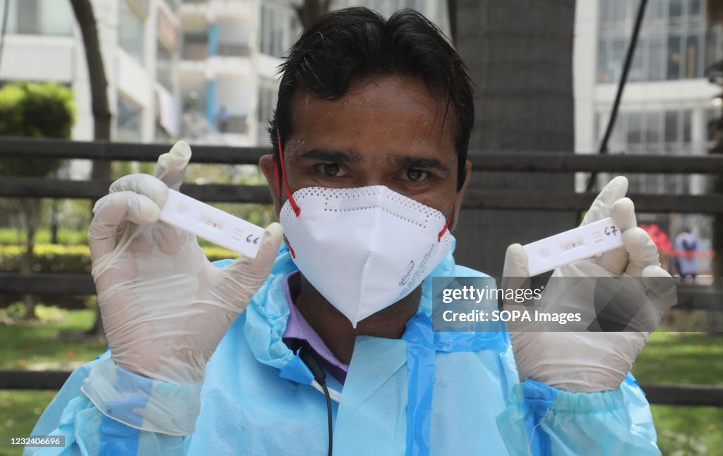 A healthcare worker wearing personal protective equipment (...