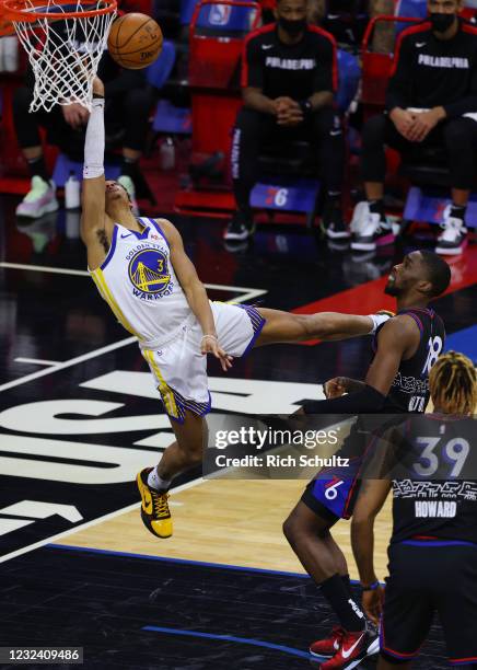 Jordan Poole of the Golden State Warriors goes up for a shot ahead of Shake Milton of the Philadelphia 76ers during the third quarter at Wells Fargo...