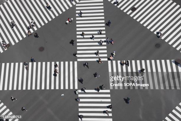 Aerial view of a crossroad on Harumi-Dori avenue inside the popular shopping district Ginza. Tokyo's government considers calling a third state of...