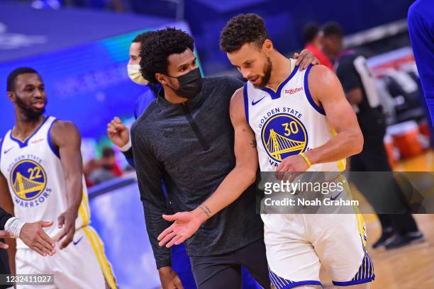 January 10: Assistant Coach Leandro Barbosa talks to Stephen Curry of the Golden State Warriors during the game against the Toronto Raptors on...