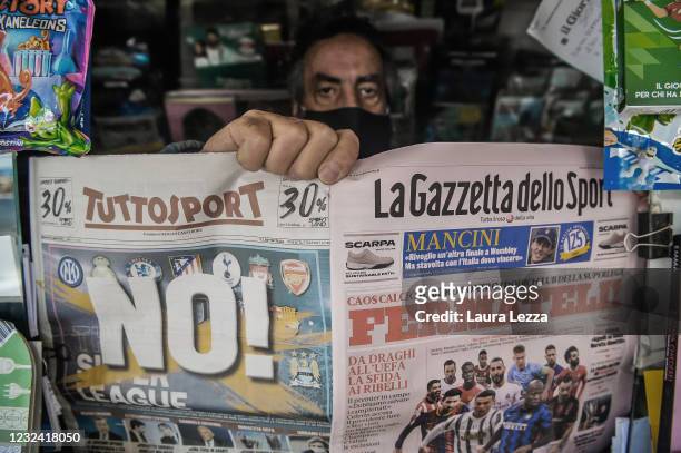 Newsagent shows two pages of the main Italian sports newspapers with a headline regarding the Super League reading 'No!' and 'Fermateli!' on April...