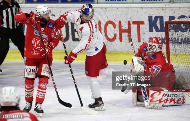 Rok Ticar of EC KAC, Sebastian Dahm, of EC KAC, Alexander Rauchenwald of EC Red Bull Salzburg battle for the ball during the Bet-at-home Ice Hockey...