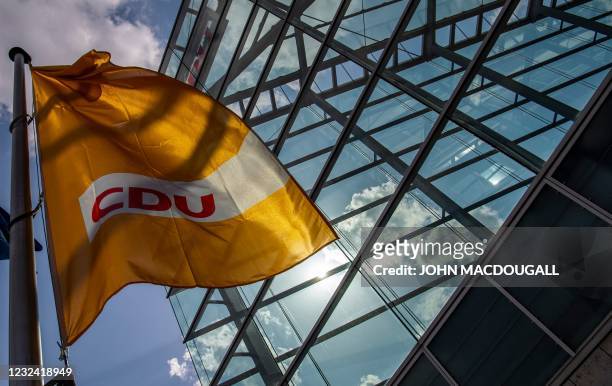 Flag bearing the colours of Germany's conservative Christian Democratic Union party flutters outside the CDU headquarters on April 20, 2021 in Berlin.