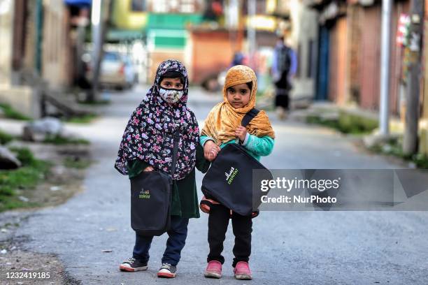 Kashmiri girls wearing Masks On way to Madrasa for Quran reading during the holy of Ramadan in Sopore Town of District Baramulla, Jammu and Kashmir,...