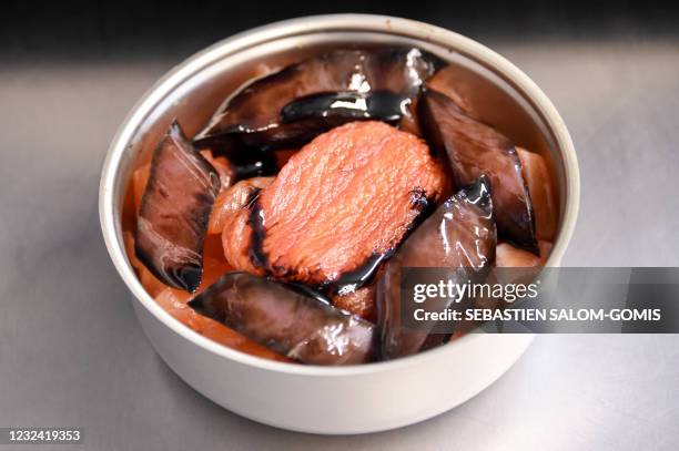 This picture taken in Pouldreuzic, near Brest, western France, on April 20, 2021 shows a low-temperature cooked salmon prepared at the canning...