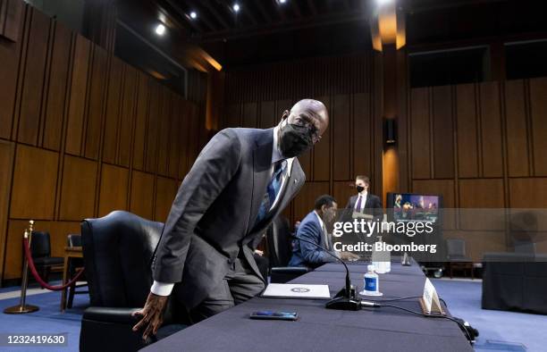 Senator Raphael Warnock, a Democrat from Georgia, left, and Representative Burgess Owens, a Republican from Utah, center, arrive to a Senate...