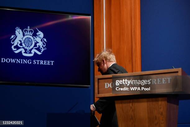 Britain's Prime Minister Boris Johnson leaves after a news conference amid the coronavirus disease pandemic at Downing Street on April 20, 2021 in...