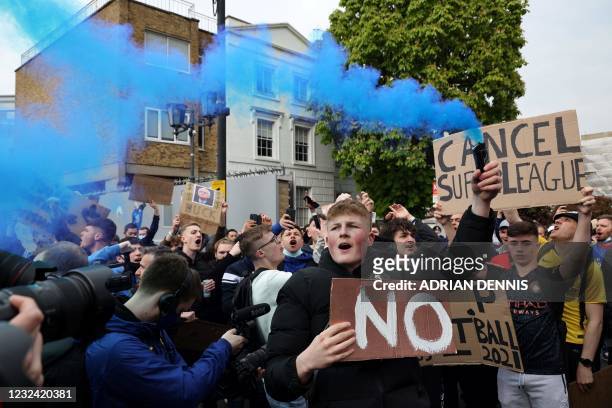 Football supporters demonstrate against the proposed European Super League outside of Stamford Bridge football stadium in London on April 20 ahead of...