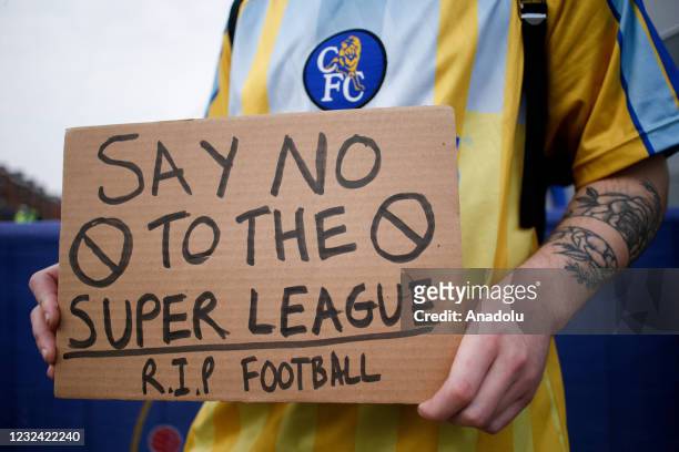 Fans protesting the establishment of the breakaway European Super League demonstrate outside Stamford Bridge stadium, home of Chelsea Football Club,...