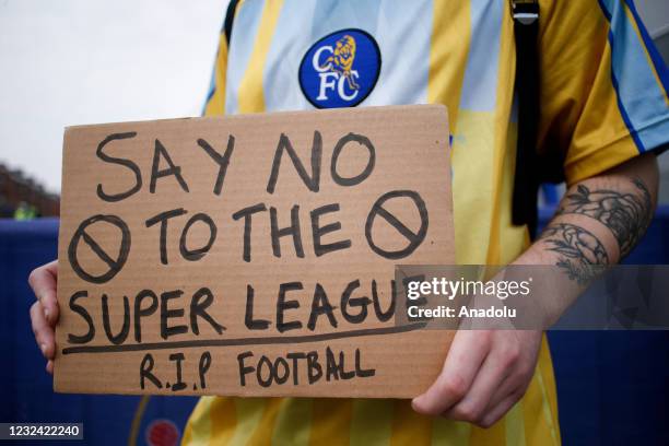 Fans protesting the establishment of the breakaway European Super League demonstrate outside Stamford Bridge stadium, home of Chelsea Football Club,...