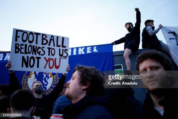 Fans celebrate as news breaks that Chelsea Football Club are to withdraw from the breakaway European Super League during a demonstration against the...