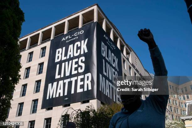 Person celebrates the verdict of the Derek Chauvin trial at Black Lives Matter Plaza near the White House on April 20, 2021 in Washington, D.C....