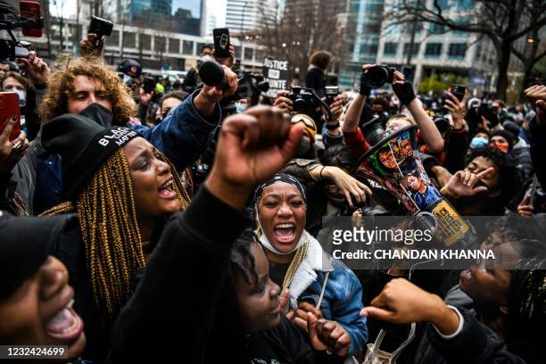 People celebrate as the verdict is announced in the trial of former police officer Derek Chauvin outside the Hennepin County Government Center in...