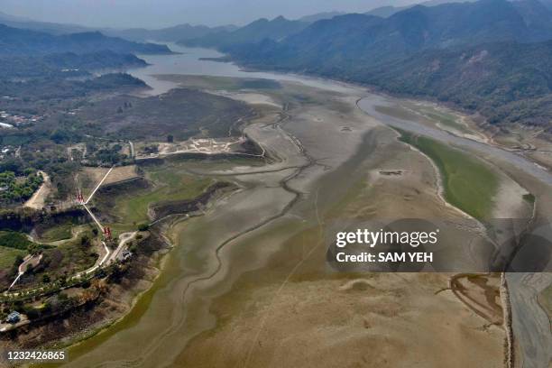 This aerial photo taken on March 17, 2021 shows the Zenwen Dam in Chiayi county, southern Taiwan. - In the foothills of Taiwan's mountainous spine,...