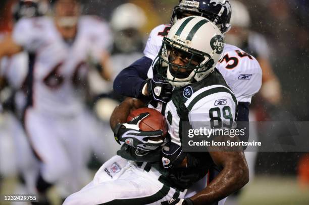 Nov 30, 2008; East Rutherford, NJ, USA: New York Jets wide receiver Jerricho Cotchery carries the ball after a reception as Denver Broncos cornerback...