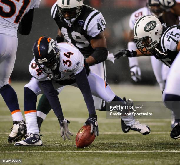 Nov 30, 2008; East Rutherford, NJ, USA: Denver Broncos cornerback Josh Bell and New York Jets full back Tony Richardson and offensive guard Robert...