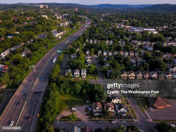 Looking south, Highway I-81 slices through this predominantly African American community of Victorian-style homes in the south side of the city on...