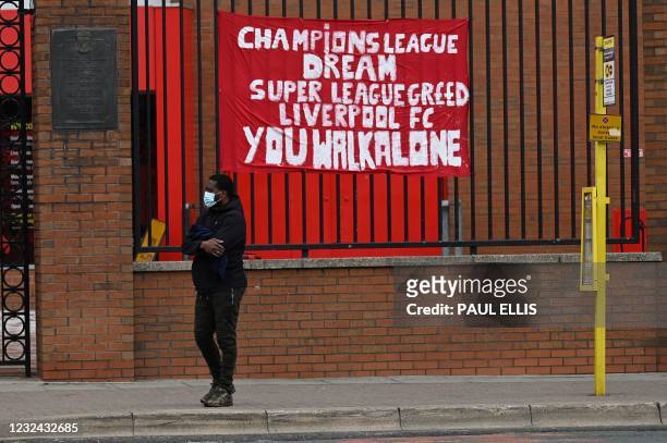 Banners critical of the European Super League project hang from the railings of Anfield stadium, home of English Premier League football club...