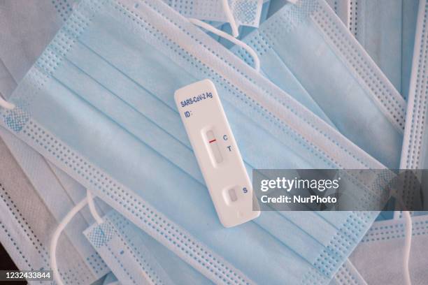Covid-19 Rapid test showing negative result as seen on medical facemasks. SARS-COV-2 Antigen Rapid Test is a self-test sold at the supermarkets in...