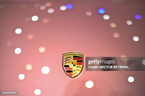 The Porsche logo is seen on a Porsche 718 Spyder car during the 19th Shanghai International Automobile Industry Exhibition in Shanghai on April 21,...