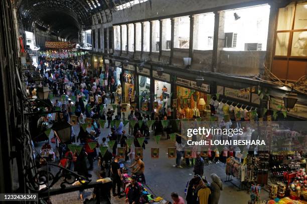 People walk at the historic Hamidiyah souk in the old city of Syria's capital Damascus on April 21 during the Muslim holy fasting month of Ramadan.