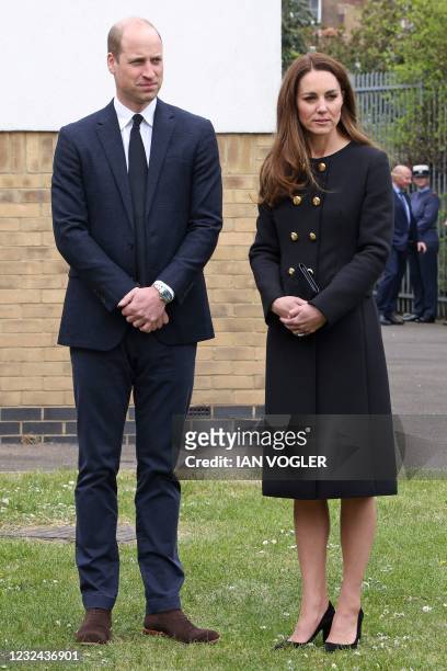 Britain's Prince William, Duke of Cambridge, and Britain's Catherine, Duchess of Cambridge, wearing black as a mark of respect following the death of...