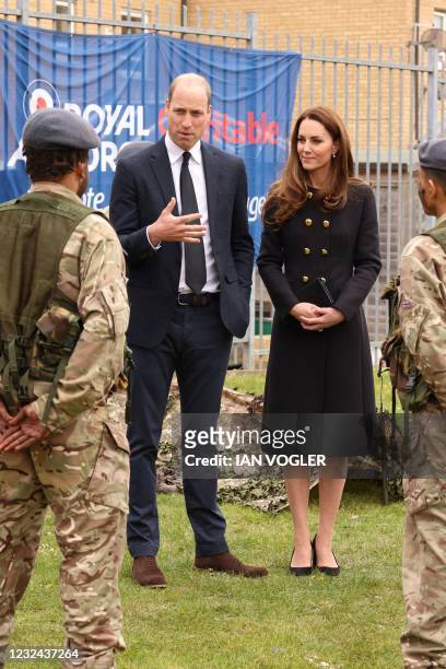 Britain's Prince William, Duke of Cambridge, and Britain's Catherine, Duchess of Cambridge, wearing black as a mark of respect following the death of...