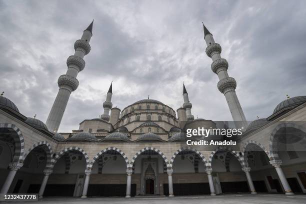 View of Central Imam Serahsi Mosque as people receive food aid packages distributed by Directorate of Religious Affairs of Turkey and Turkiye Diyanet...